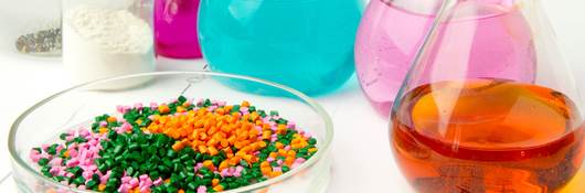 Plastic raw material in granules against the background of Chemical Laboratory and reagents. Polypropylene, Ethylene, Polypropylene research in laboratory conditions