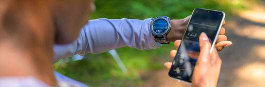 A person using tracker software and a smart watch
