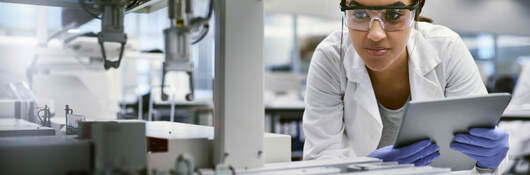 Scientist using a digital tablet while working in a laboratory