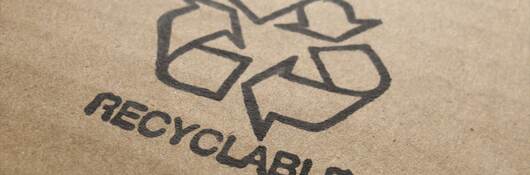 Recyclable icon on cardboard box.