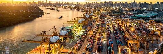 Aerial view of cranes loading shipping containers
