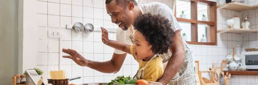 Father and son cooking.