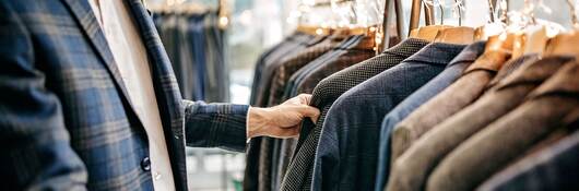 Man picking suits