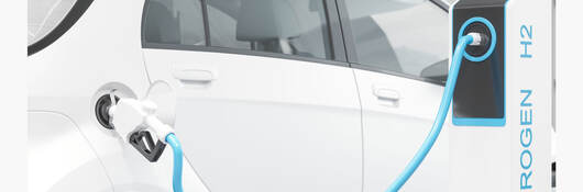 A car at a hydrogen fuel filling station