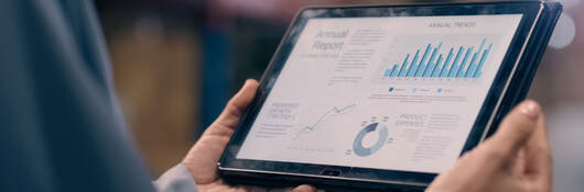 Person looking at an analytics dashboard on a tablet
