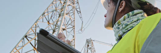 An engineer working in the field with high voltage