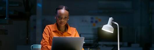Person looking at a laptop computer.