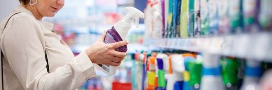 Person shopping for cleaning products.