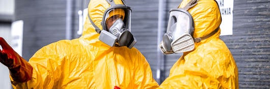 Two workers in hazmat suits