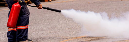 A fireworker extinguishing a fire