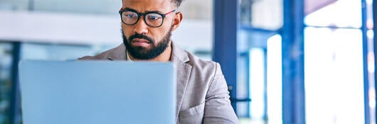 Person looking at laptop computer.