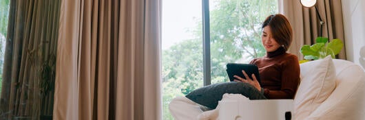 A person reading in a chair