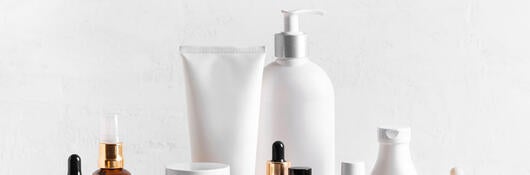 Several bottles and tubes of skincare products