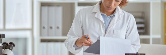 chemistry lab technician analyzing results 