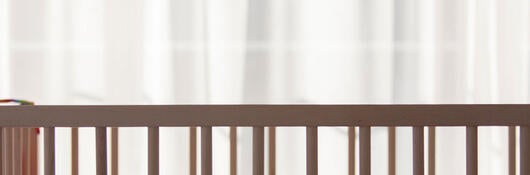A baby sleeping in a crib