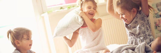 Kids having a pillow fight