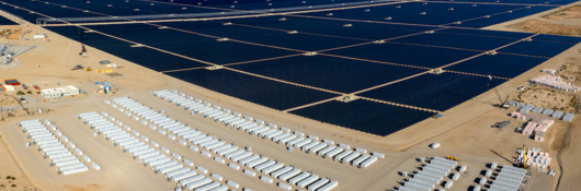 Battery energy storage system next to solar farm in the desert