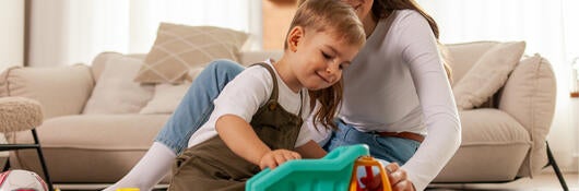 Mother and son playing with a toy