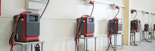 UL Solutions field engineers visit manufacturing sites to evaluate whether a product, such as a forklift battery or a battery charger, continues to comply with the original certification requirements.