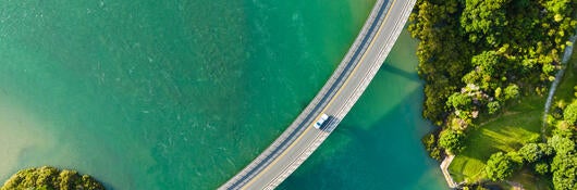 car driving on bridge over water