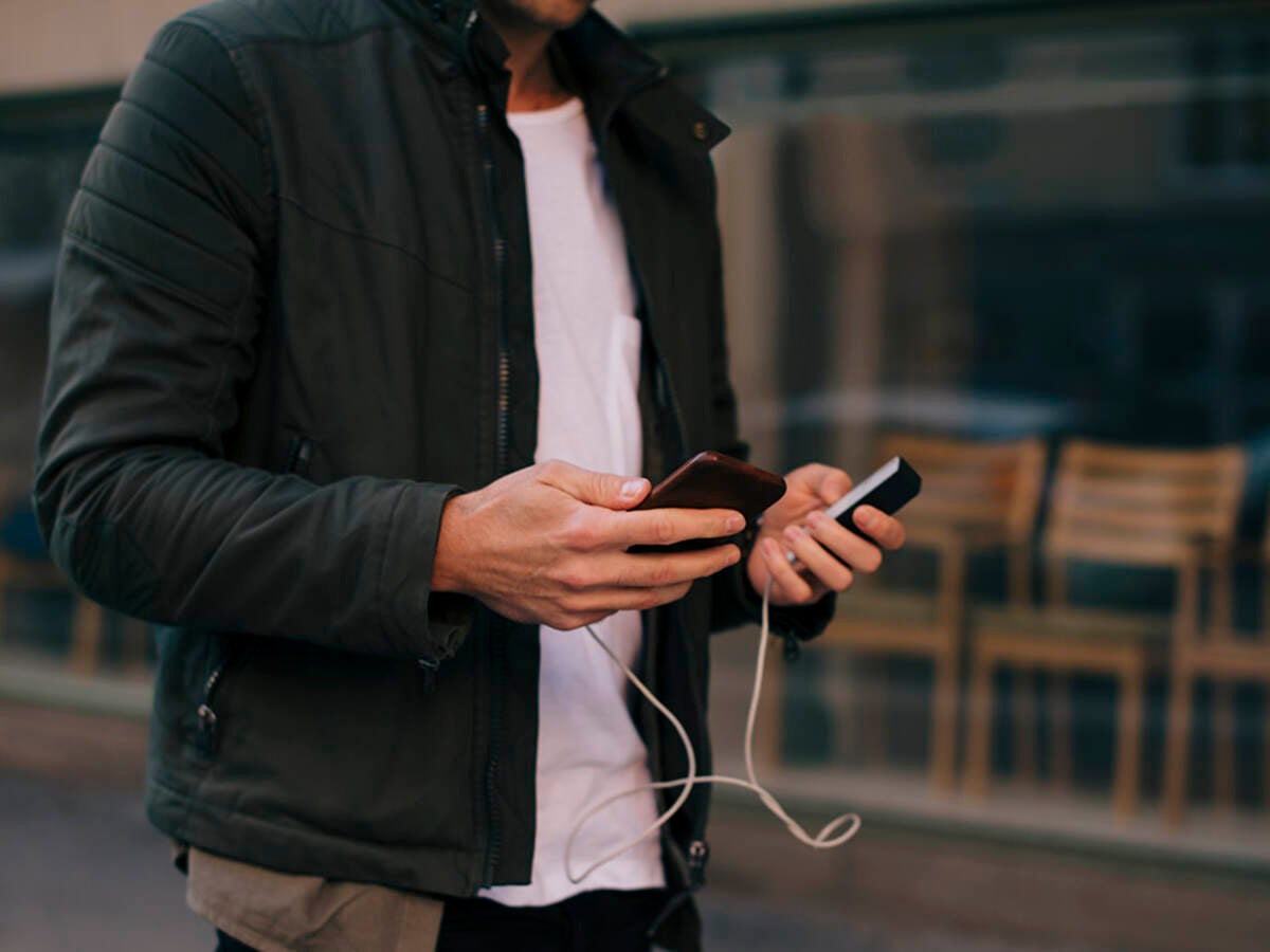 Connected device being held by man