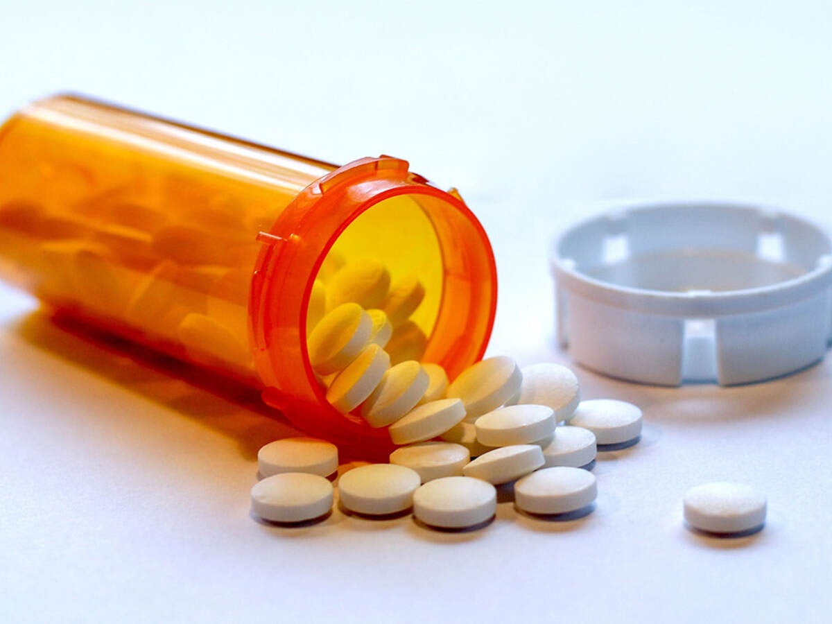 opioid crisis - open bottle of prescription painkiller pills