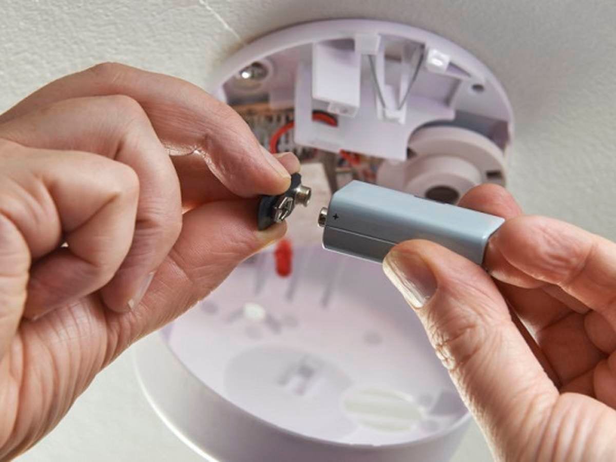close up of replacing battery in domestic smoke alarm, , 