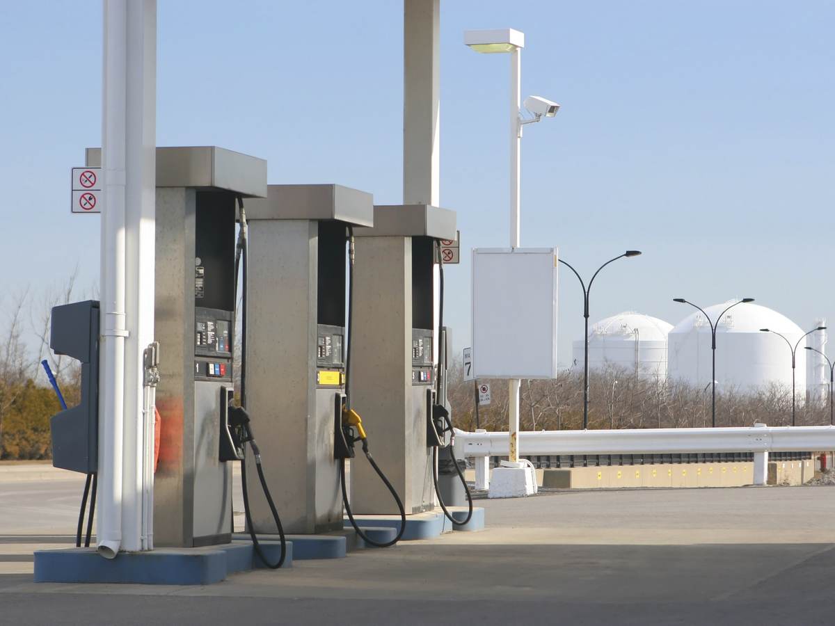 Three pumps at a gas station. 