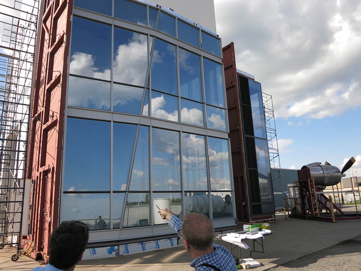 Contractors inspecting building