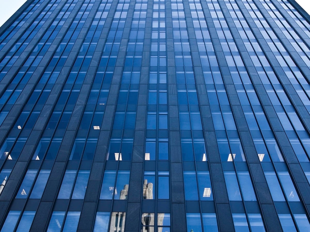 Looking up at a skyscraper. 