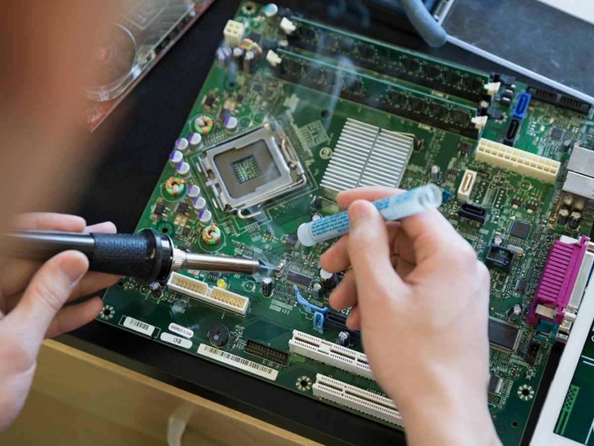 Person soldering a circuit board