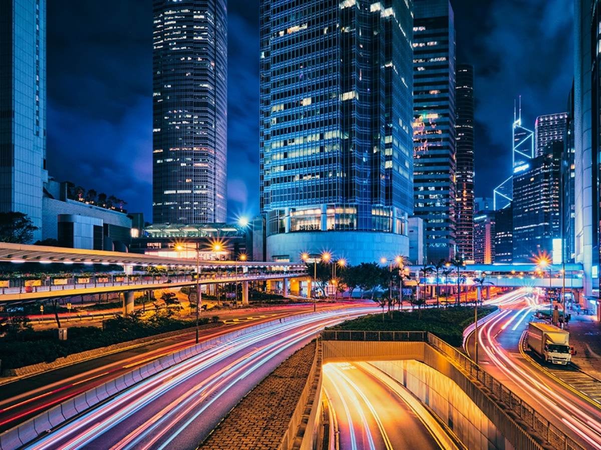 City at night with blurred cars