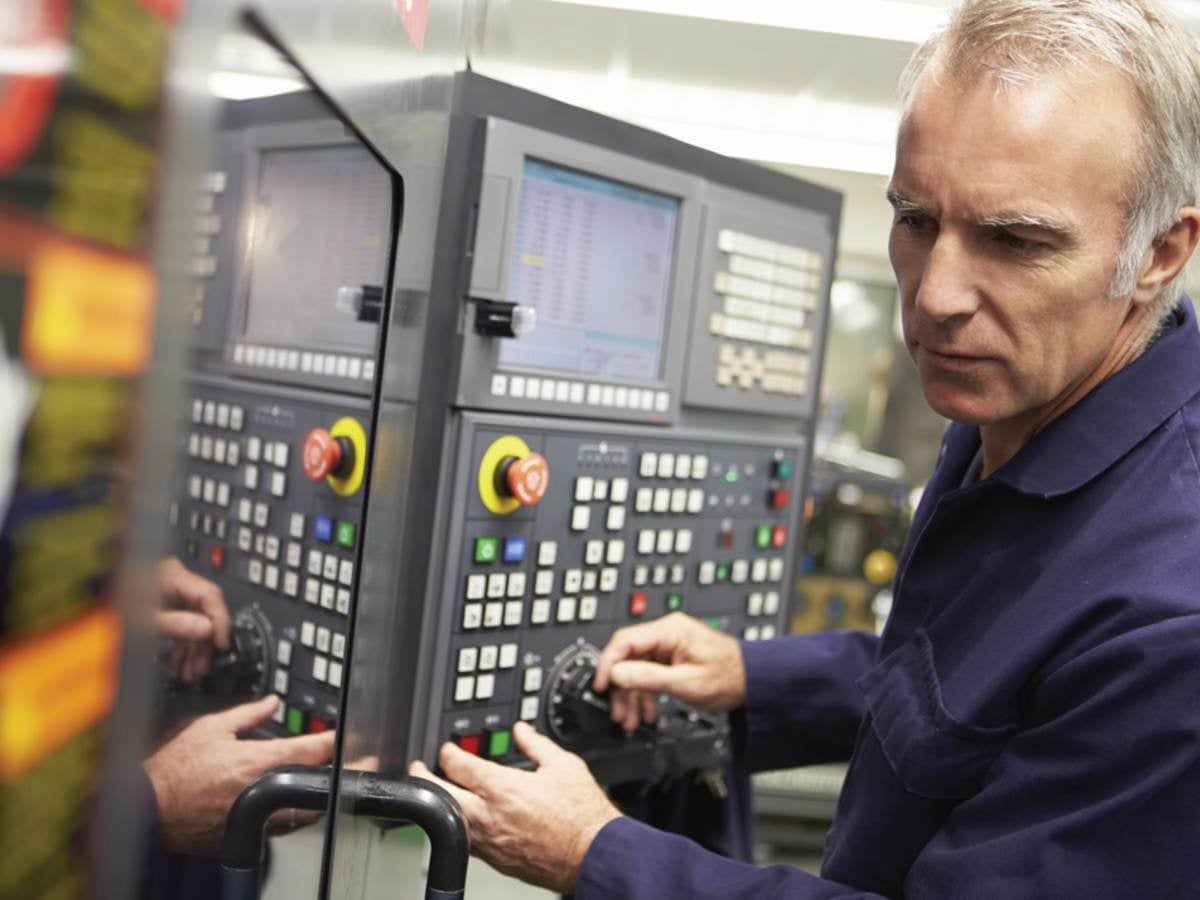 Technician working on an industrial control panel