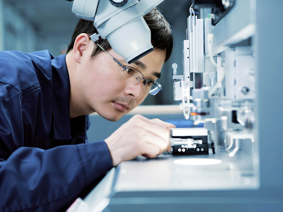 Man looking at test instrument