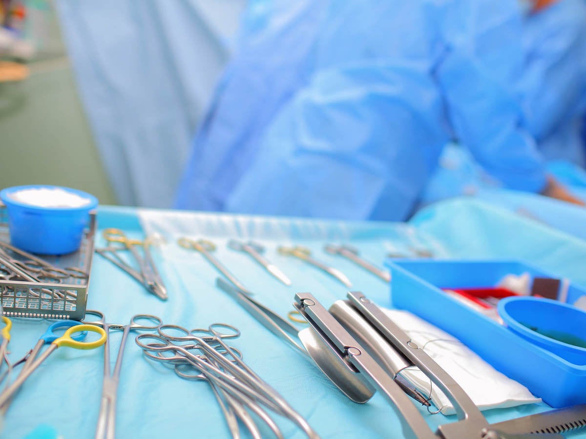 Sterile surgical equipment laid out on a tray in an operating room 