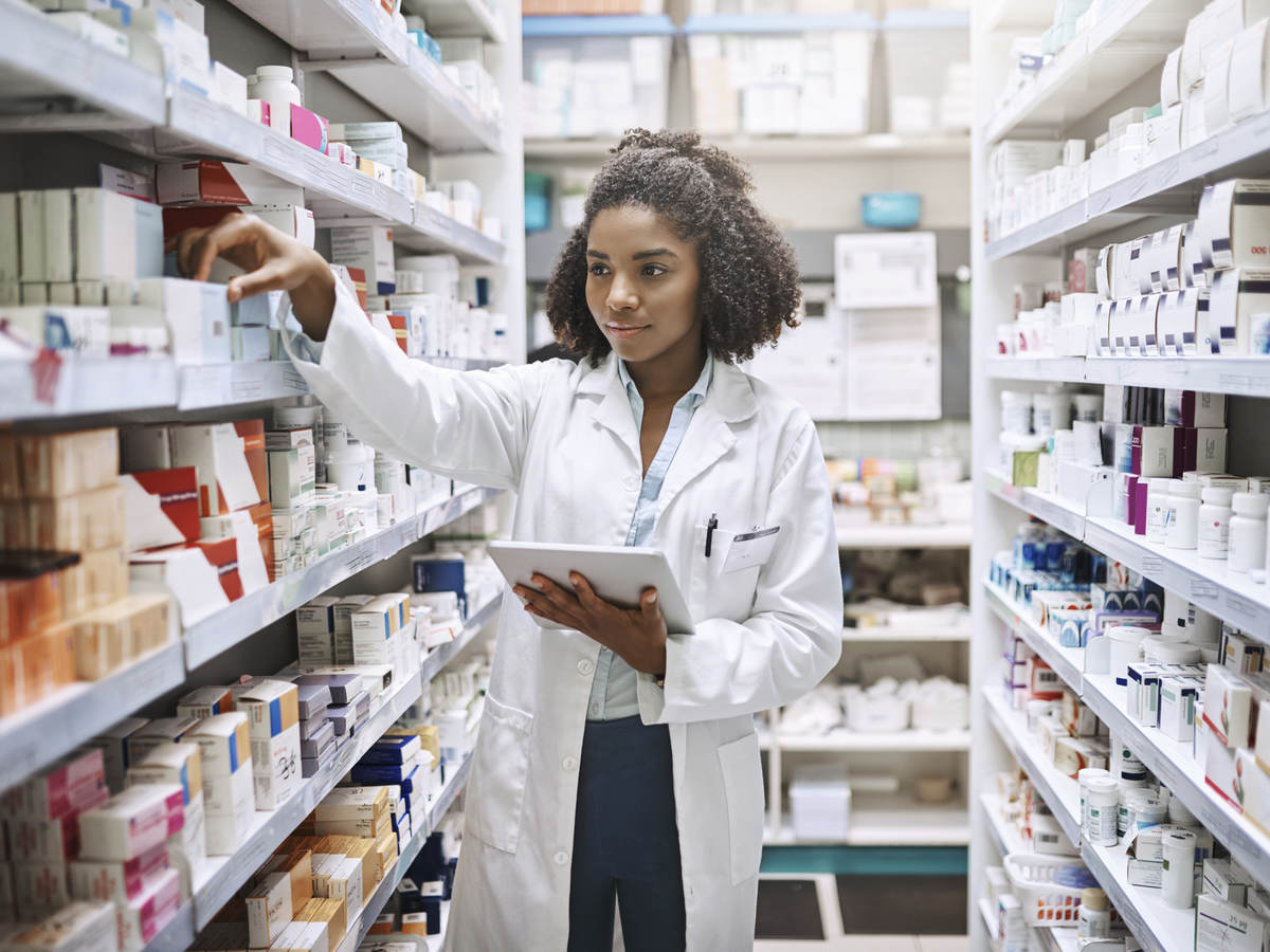 pharmacist with a tablet