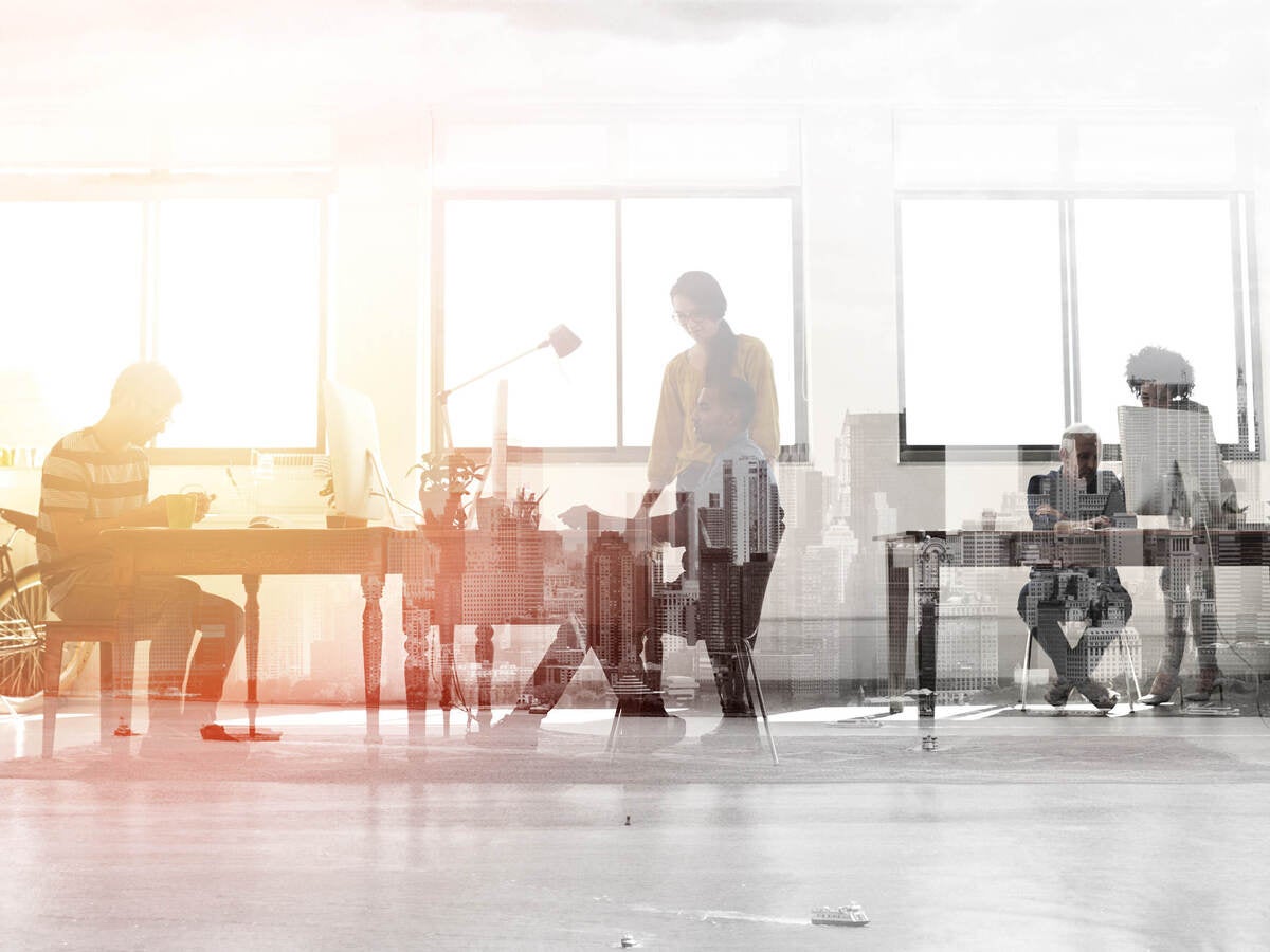 Black and white photo of people in an office