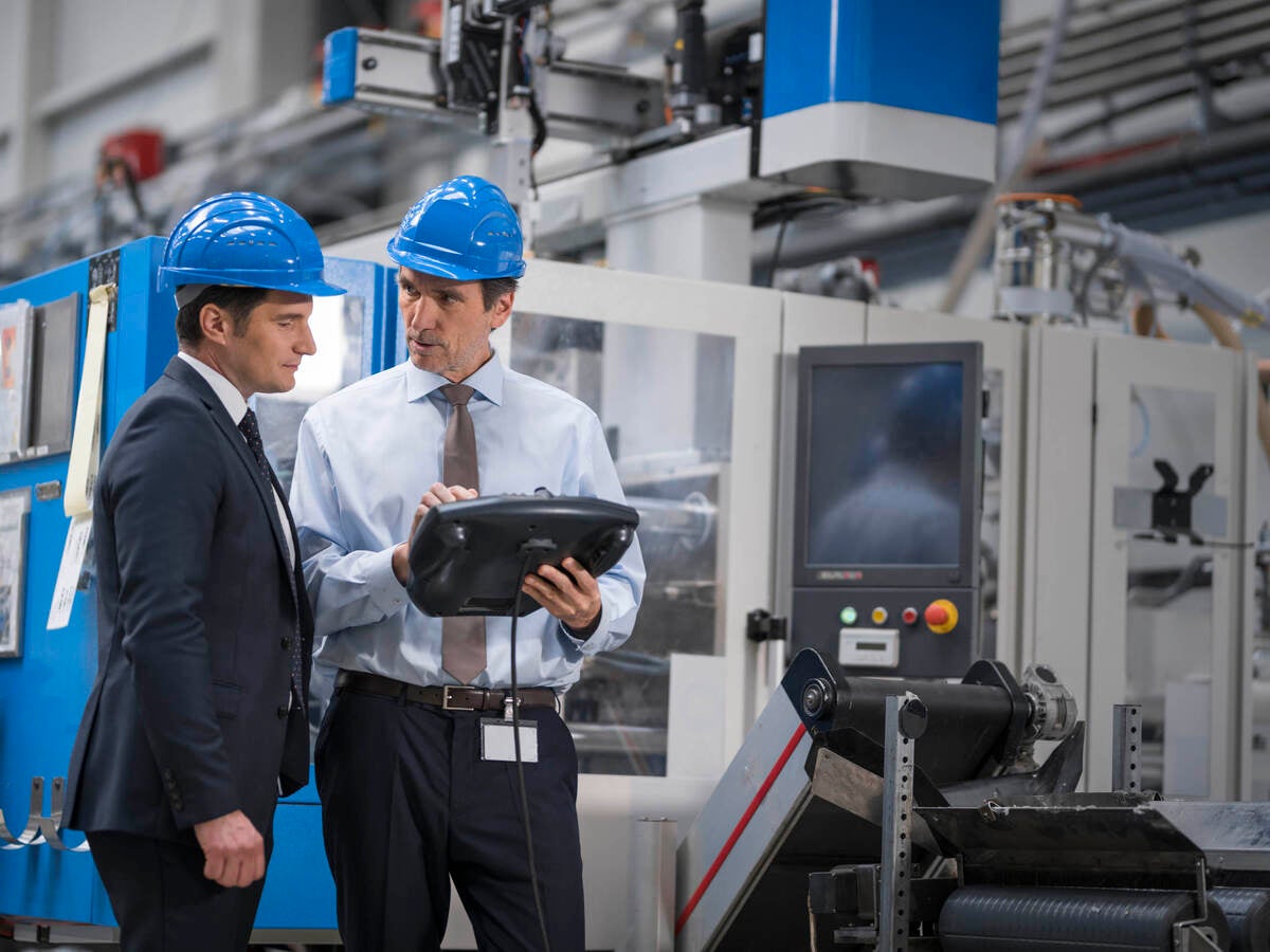 engineers speaking in factory