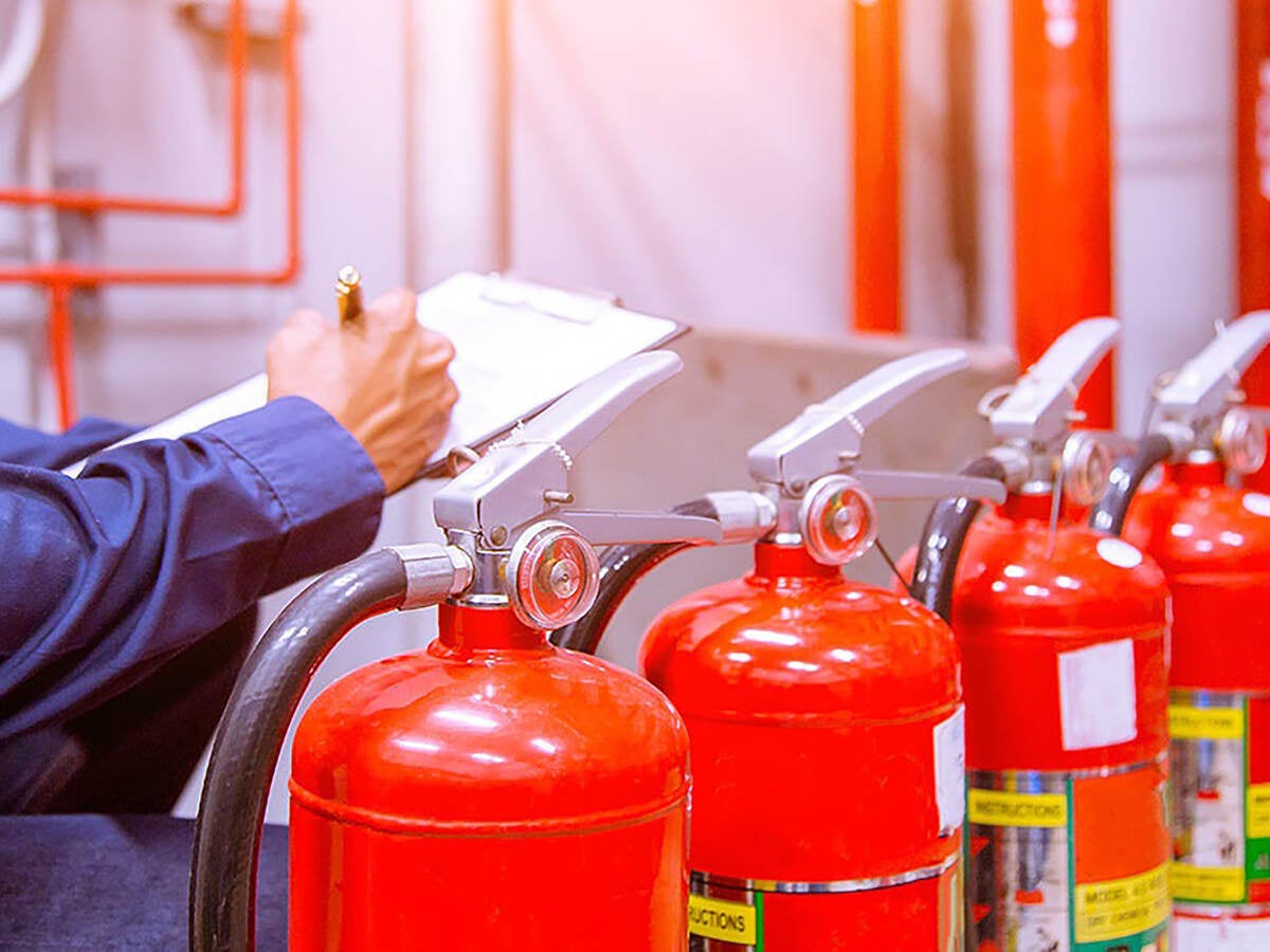 Photo of Engineer checking Industrial fire control system