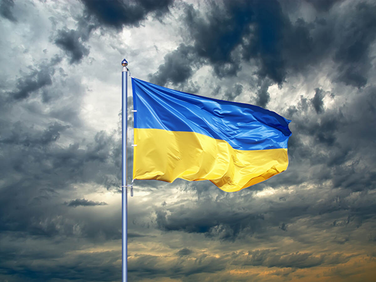 Ukraine flag against stormy sky