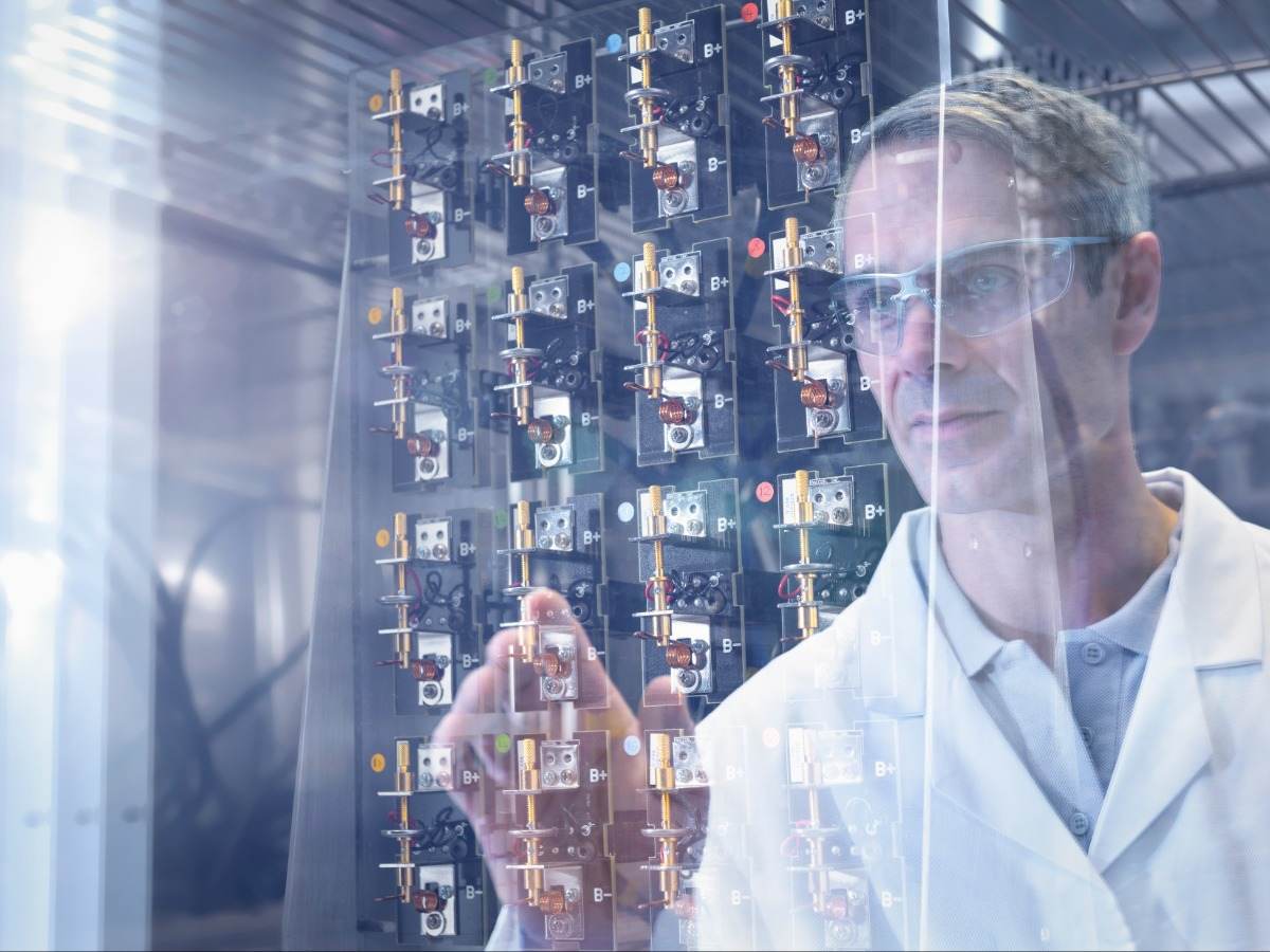 Engineer inspecting components in lab