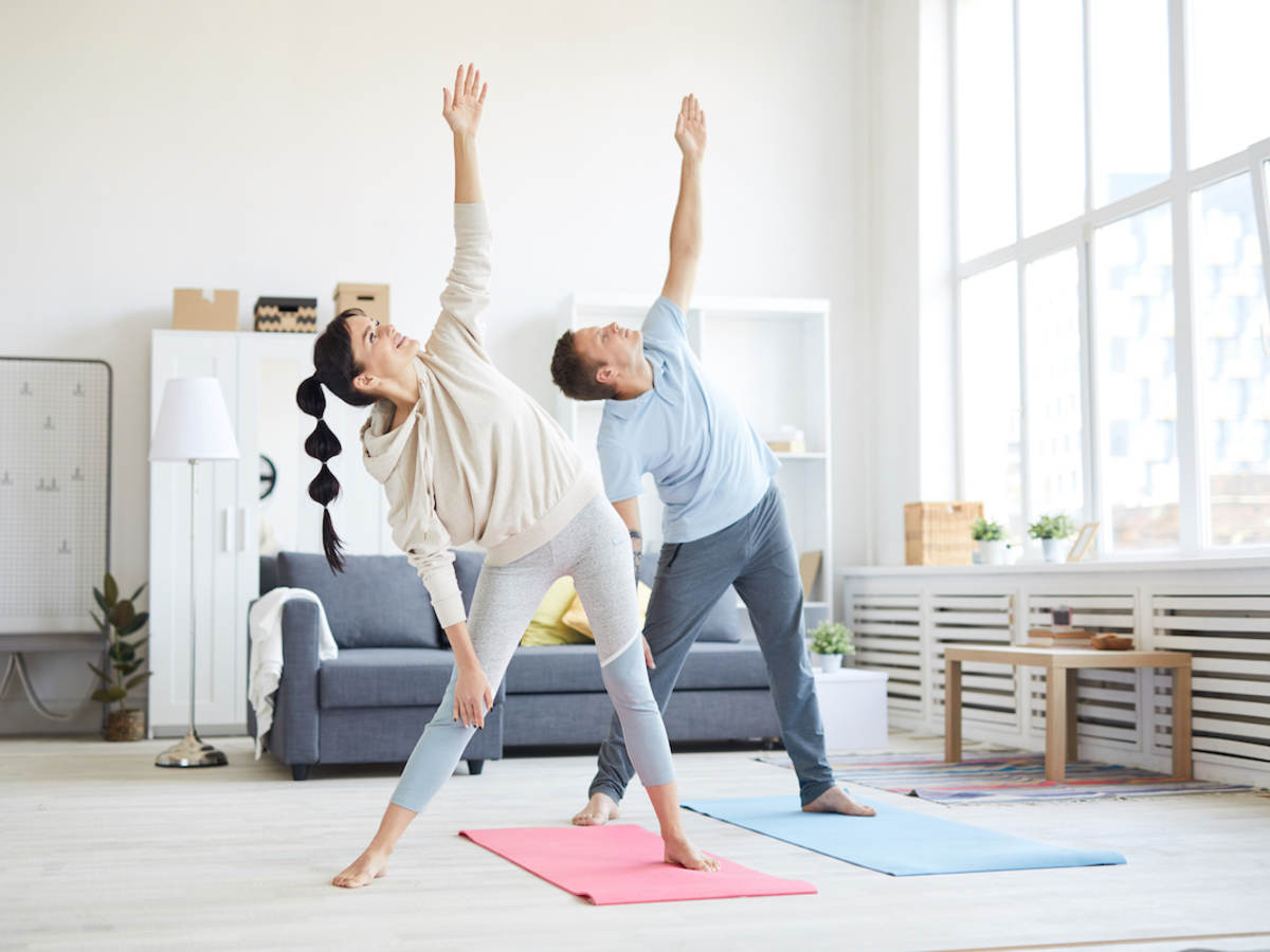 Happy couple doing yoga
