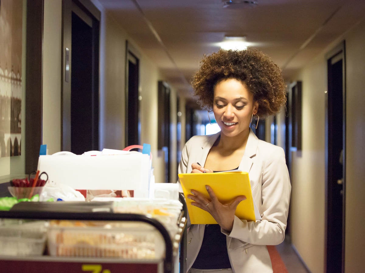 Woman doctor viewing charts in the hospital