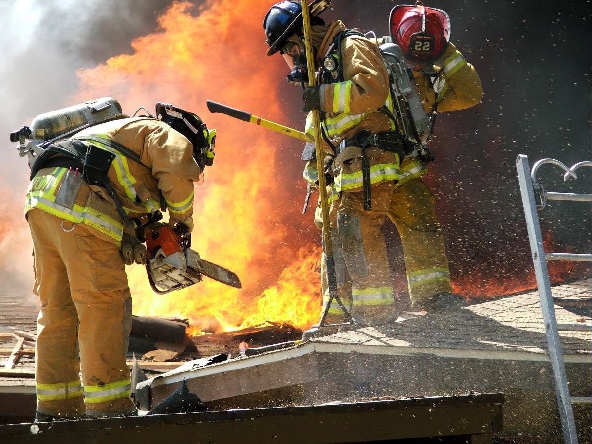 Firefighters working on roof