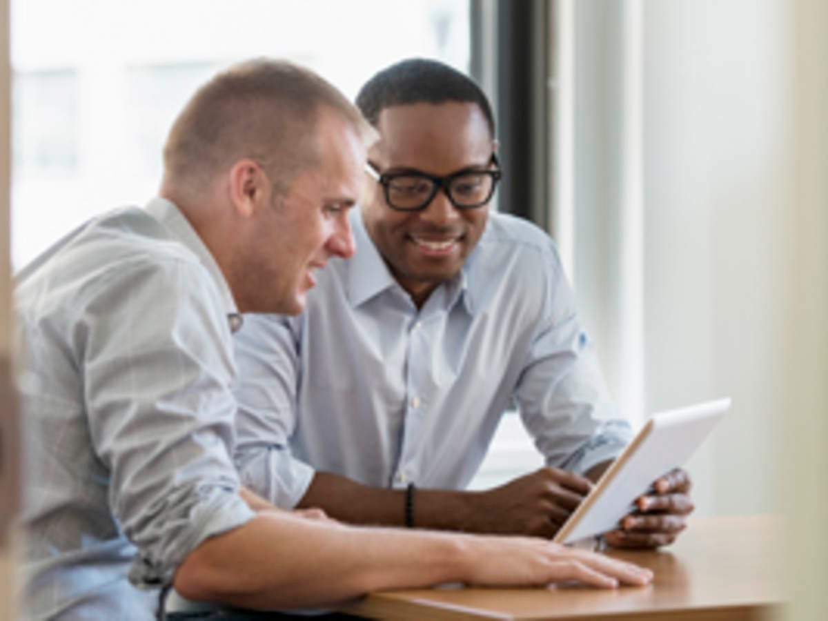 business men looking at tablet