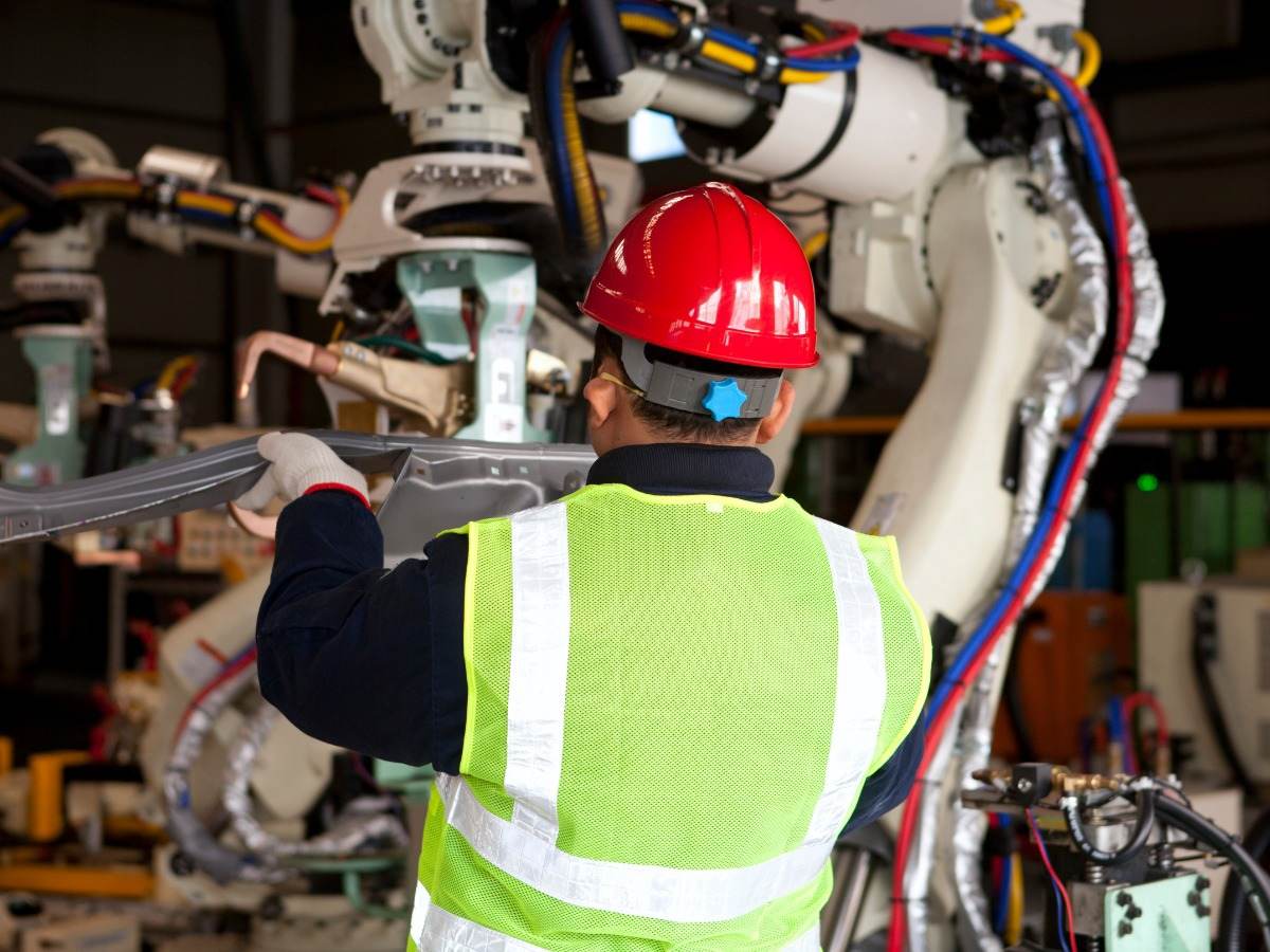 Operator in factory testing robot machine