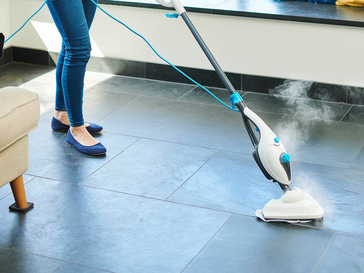 Steam cleaner mop cleaning a floor