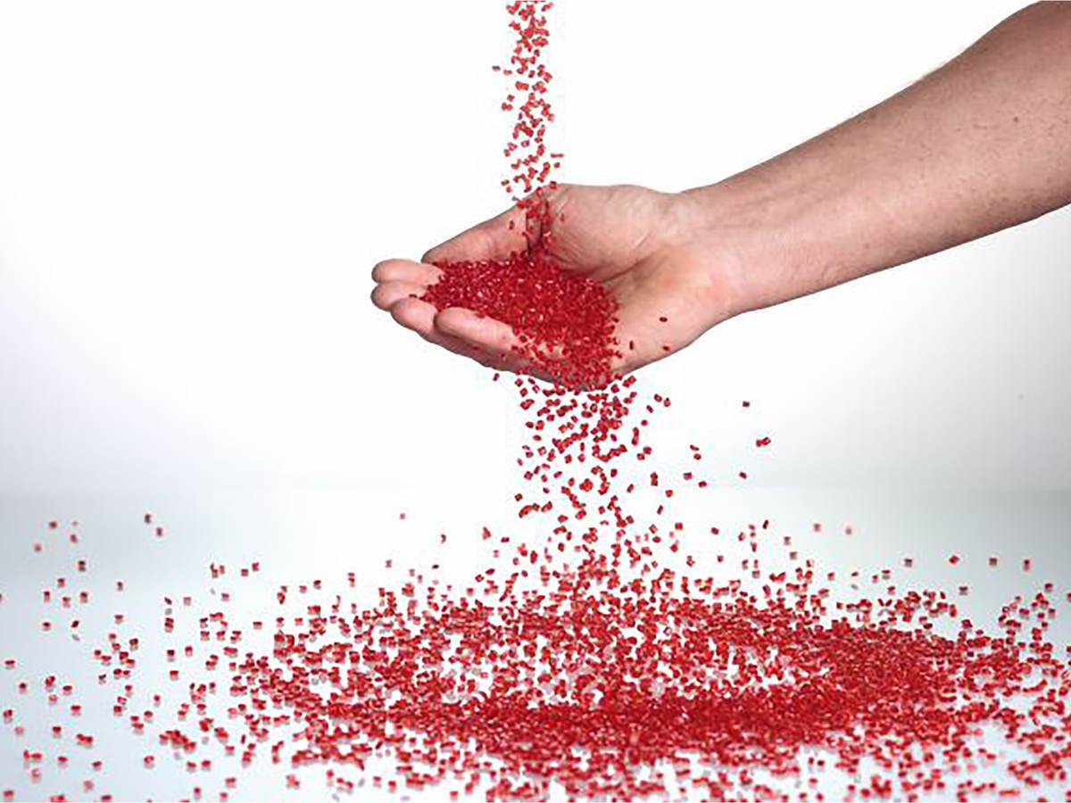 Hand catching plastic pellets