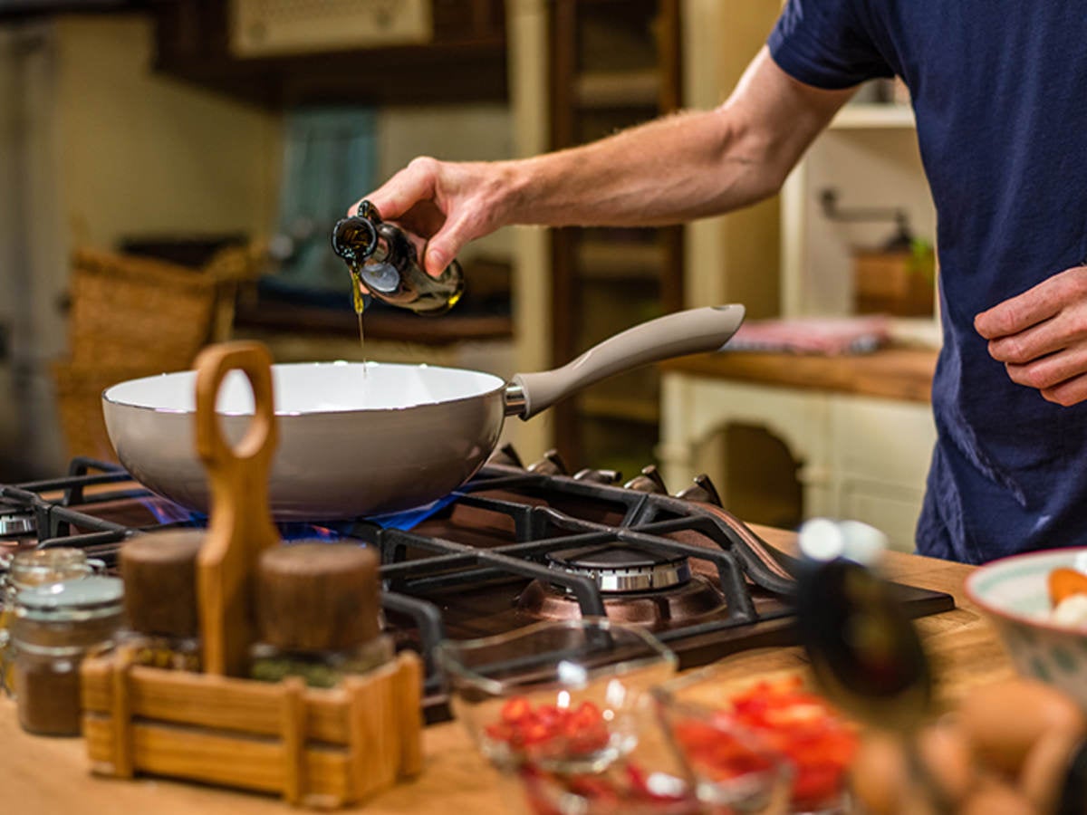 Man cooking on stove top.