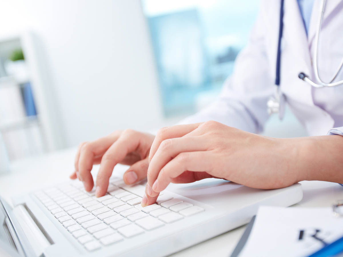 Medical professional typing